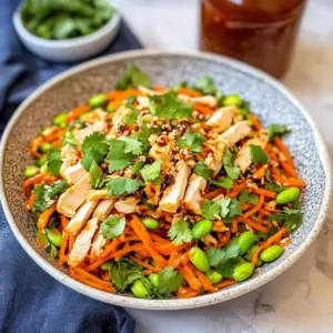 Asian carrot salad with chicken and edamame
